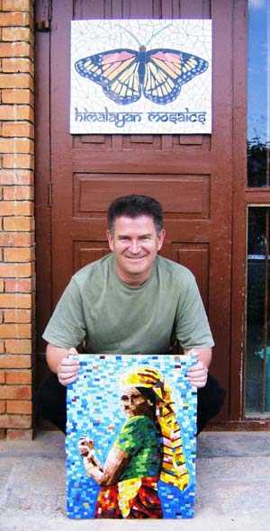 Philip Holmes holding a mosaic